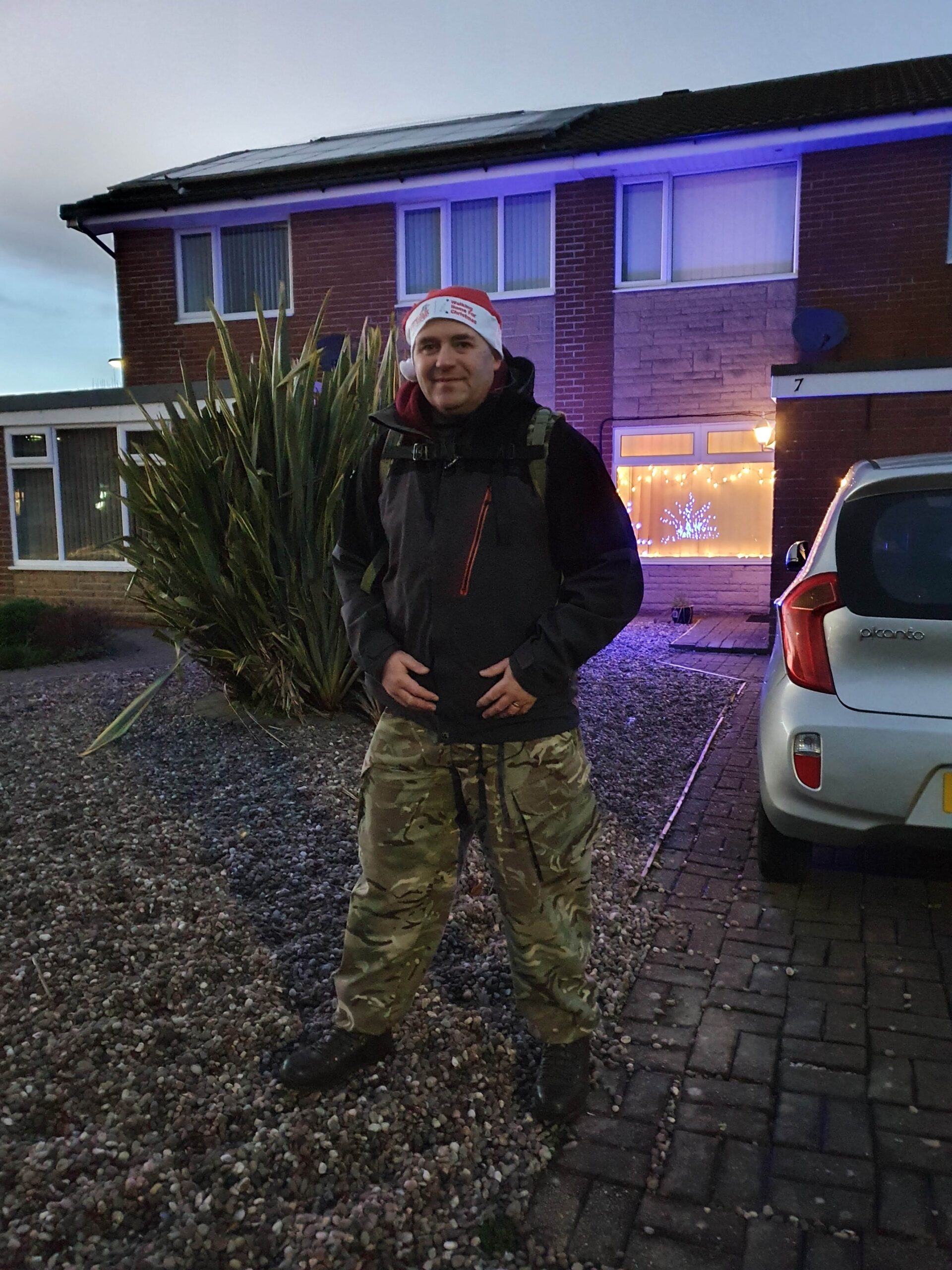 Picture stood outside the house after Walking Home for Christmas